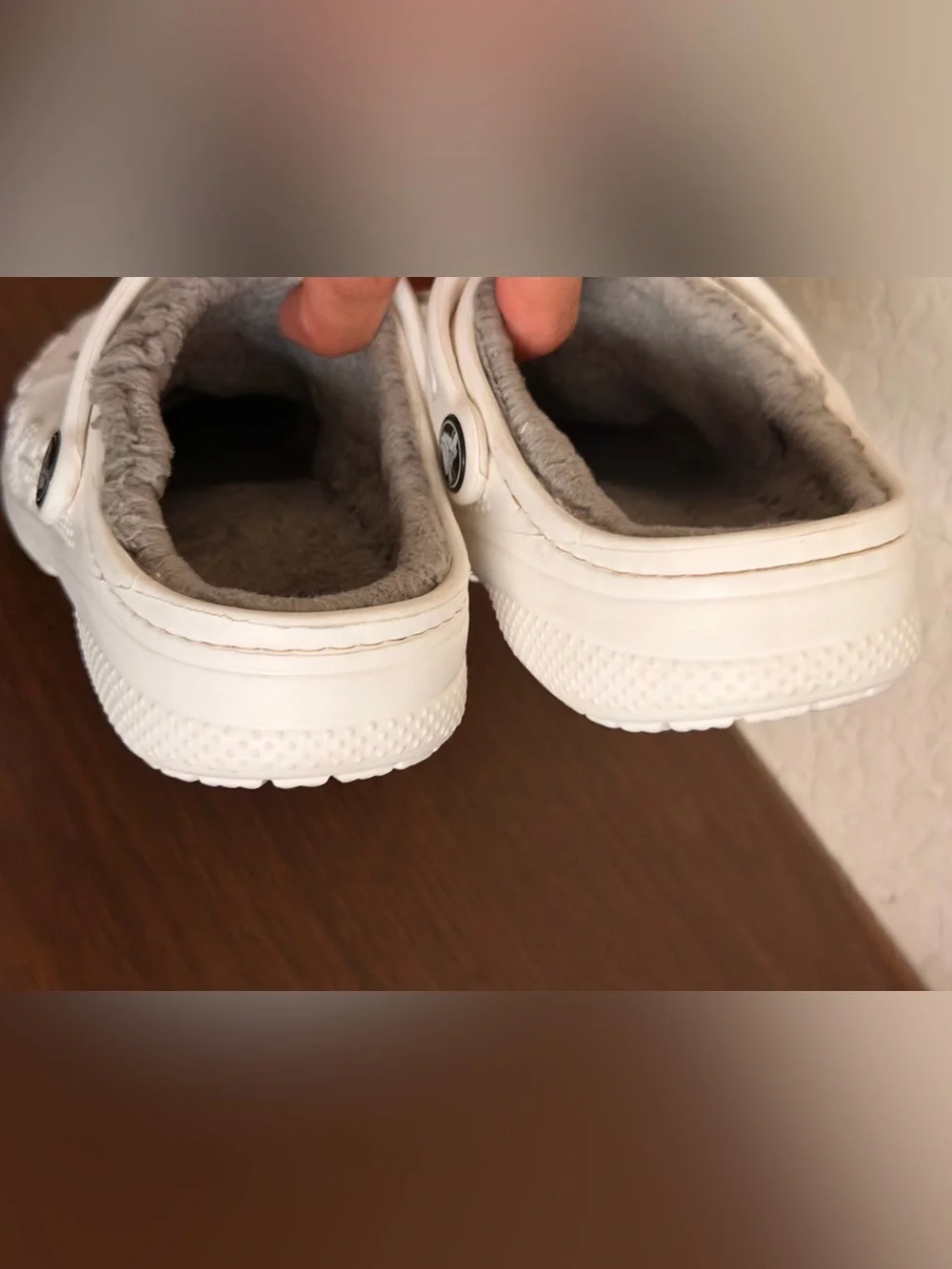 white Crocs Baya Lined Clogs featuring a cozy grey faux-fur lining. C-12